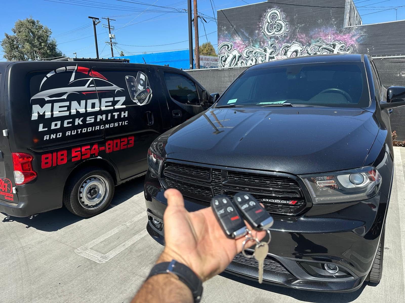 Mendez AutoLocksmith van and customer with new car keys